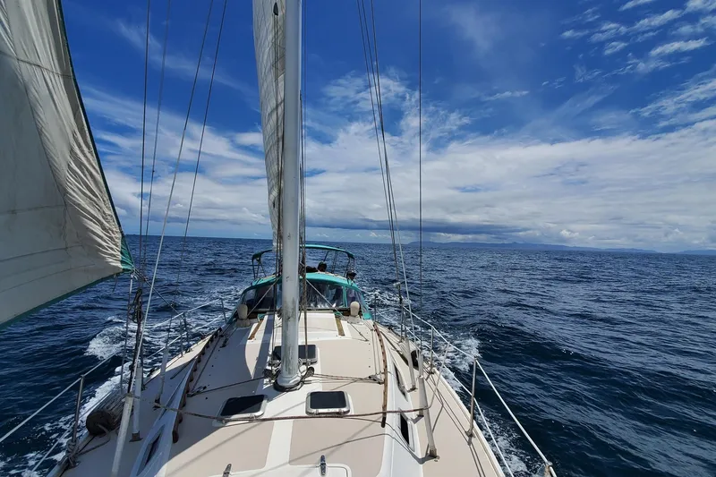 Slide: The Image of Sailing on a 1987 Catalina 36 yacht under a clear blue sky. - 2