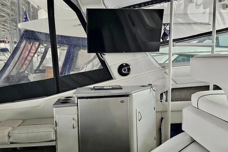 Slide: The Image of Interior of 1994 Sea Ray 440 Sundancer yacht with modern amenities and sleek design. - 11