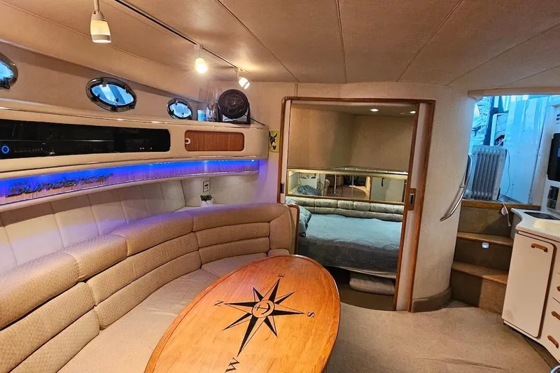 Slide: The Image of Luxurious interior of 1994 Sea Ray 440 Sundancer yacht with plush seating and elegant decor. - 15
