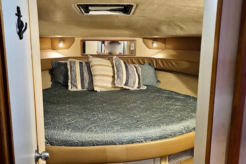 Slide: The Image of Interior of 1994 Sea Ray 440 Sundancer yacht kitchen with modern appliances. - 19