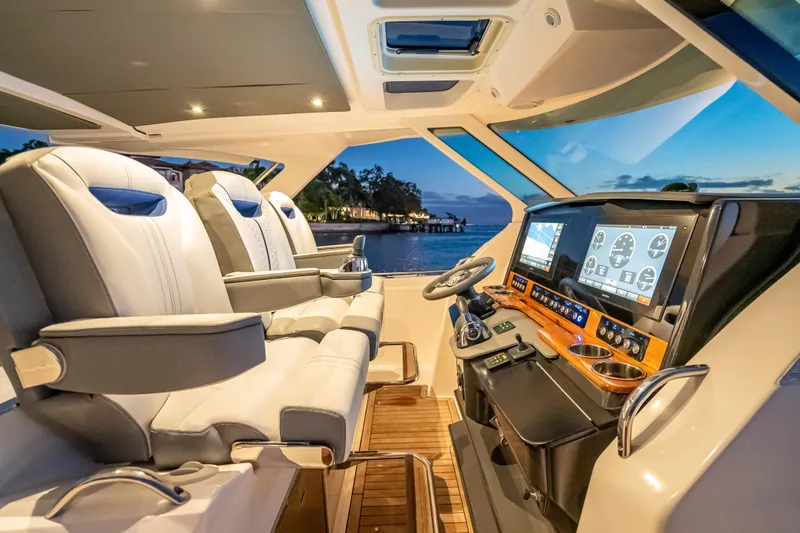 Slide: The Image of Luxurious 2019 Tiara Yachts 38 LS cockpit with modern controls and plush seating. - 10
