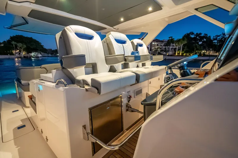 Slide: The Image of Luxurious 2019 Tiara Yachts 38 LS interior with plush seating and modern helm. - 12