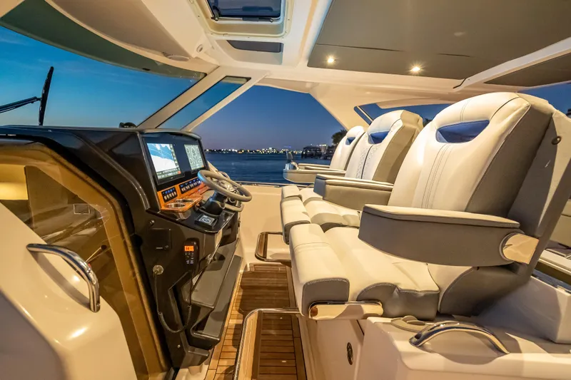 Slide: The Image of Luxurious 2019 Tiara Yachts 38 LS cockpit with plush seating and advanced navigation system. - 21