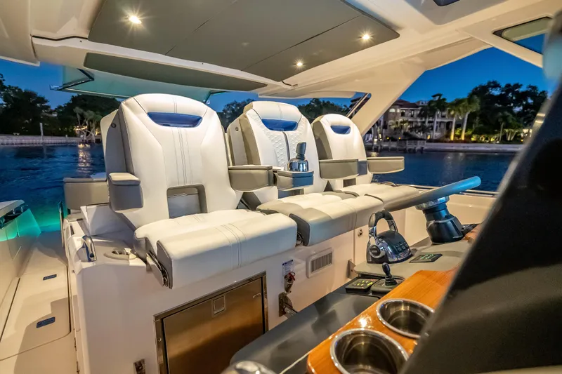 Slide: The Image of Luxurious interior of 2019 Tiara Yachts 38 LS with plush seating and modern controls. - 22