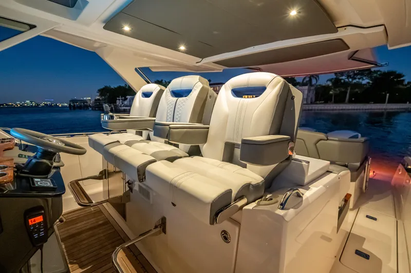 Slide: The Image of Luxurious interior of 2019 Tiara Yachts 38 LS with plush seating at sunset. - 24