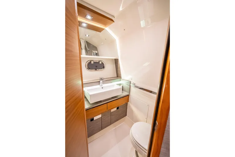 Slide: The Image of Luxurious bathroom interior of 2019 Tiara Yachts 38 LS with modern sink and toilet. - 32