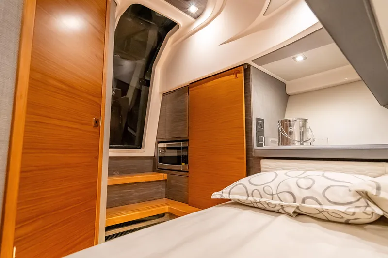 Slide: The Image of Luxurious interior cabin of 2019 Tiara Yachts 38 LS with modern wood finishes. - 35