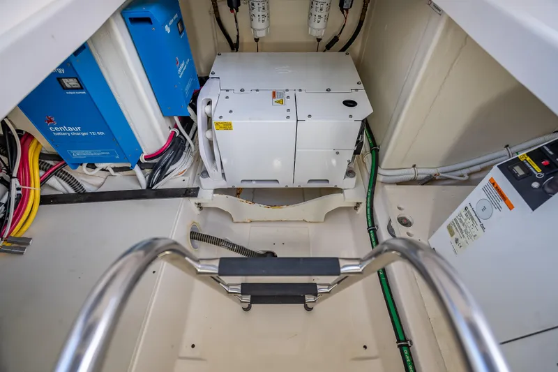 Slide: The Image of Engine compartment of 2019 Tiara Yachts 38 LS with electrical components and wiring. - 39