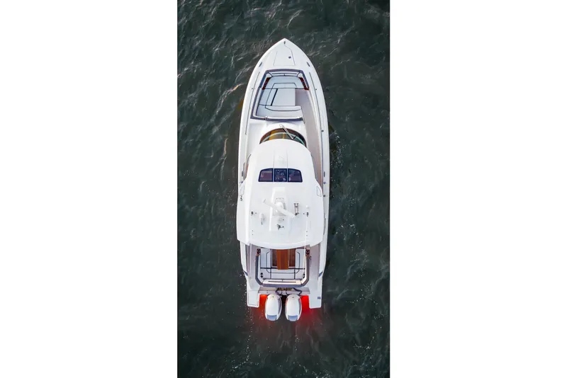 Slide: The Image of Aerial view of 2019 Tiara Yachts 38 LS cruising on water. - 9
