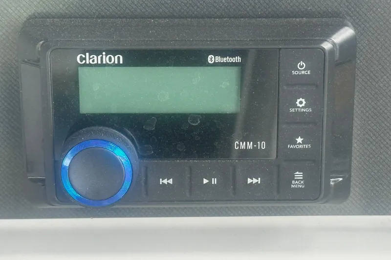 Slide: The Image of Clarion CMM-10 Bluetooth stereo system in 2026 Sweetwater EX 2286 SFLX boat. - 10