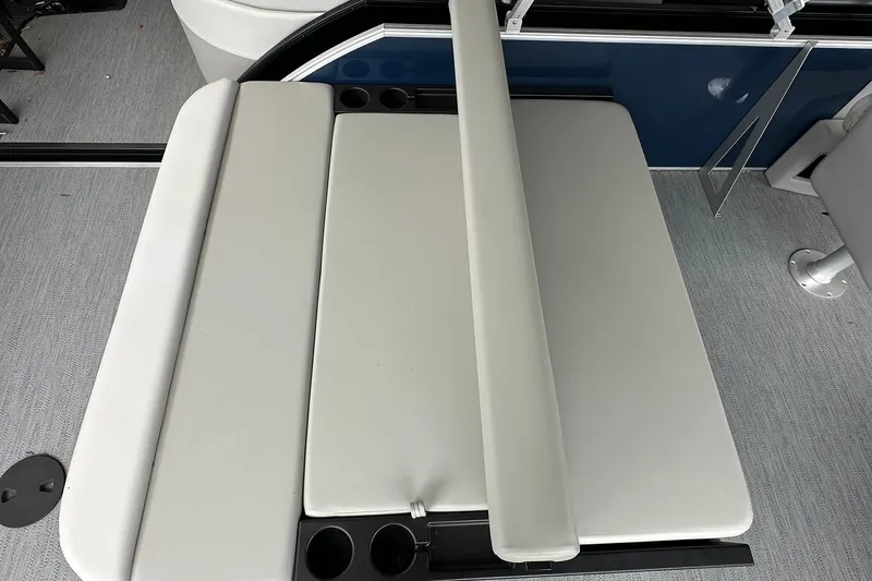 Slide: The Image of Sweetwater EX 2286 SFLX 2026 boat seating area with cup holders and sleek design. - 12