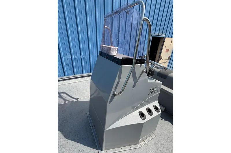 Slide: The Image of 2024 Xpress H190B Bay boat console with windshield and stainless steel rails. - 11