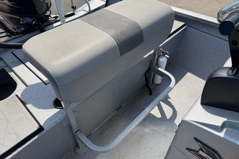 Slide: The Image of 2024 Xpress H190B Bay boat interior with cushioned seat and safety equipment. - 15
