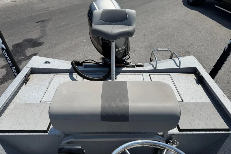 Slide: The Image of 2024 Xpress H190B Bay boat interior with seating and Yamaha 115 engine. - 16