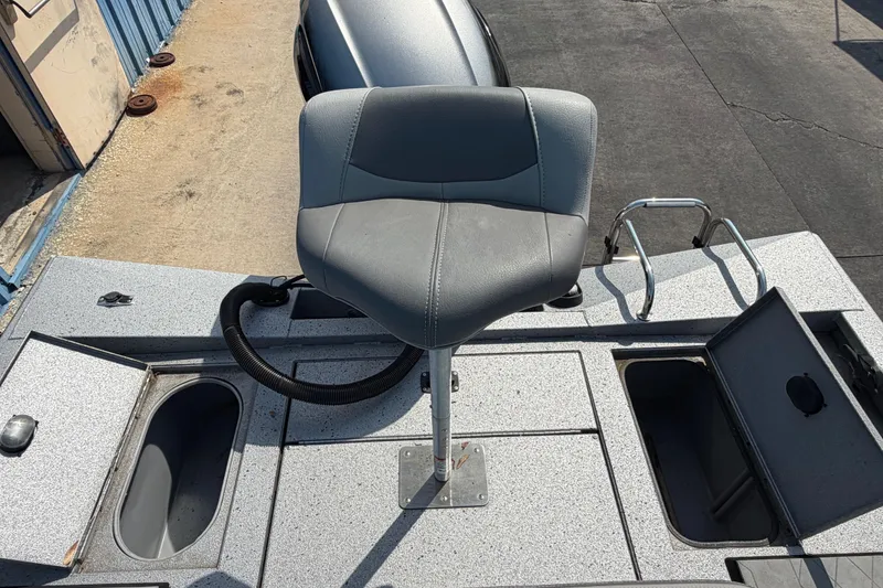 Slide: The Image of 2024 Xpress H190B Bay boat seat and storage compartments on deck. - 17