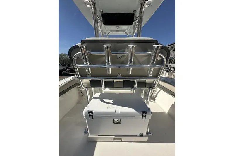 Slide: The Image of 2026 Key West 219 FS boat interior with seating and cooler. - 12