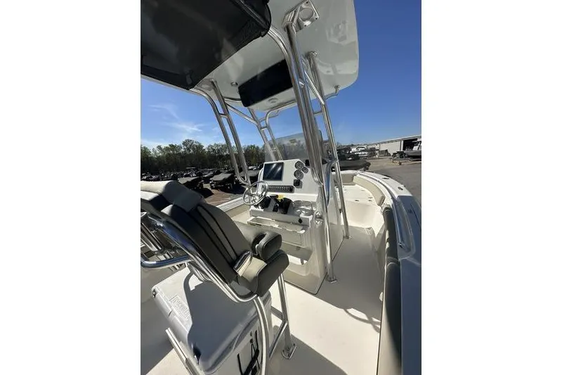 Slide: The Image of 2026 Key West 219 FS boat interior with modern helm and seating. - 8