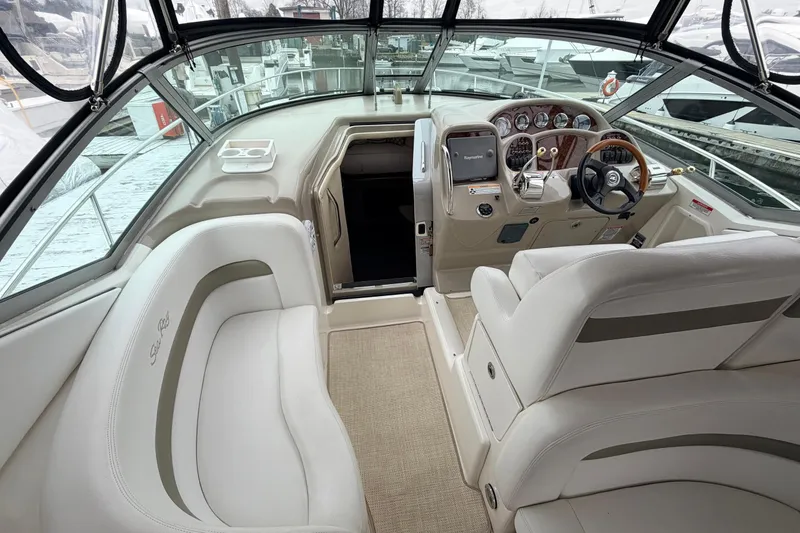 Slide: The Image of 2007 Sea Ray Sundancer 320 cockpit with luxurious seating and modern controls. - 16