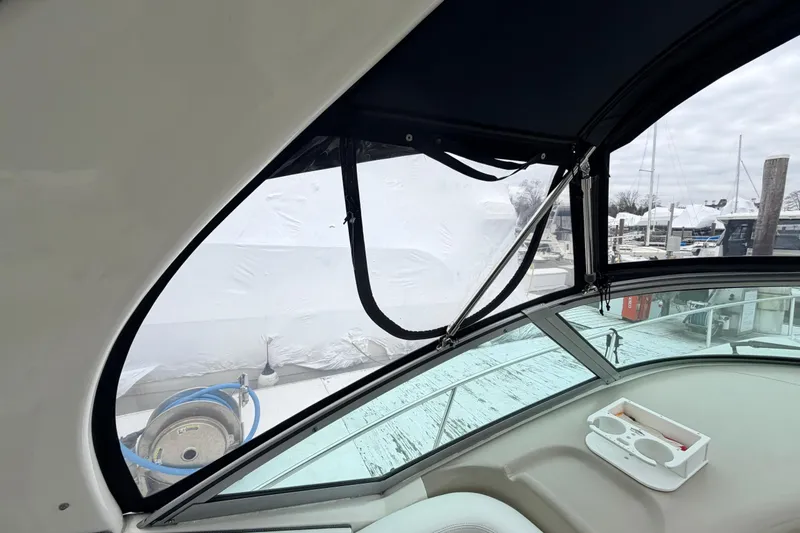 Slide: The Image of Interior view of a 2007 Sea Ray Sundancer 320 boat with marina background. - 18