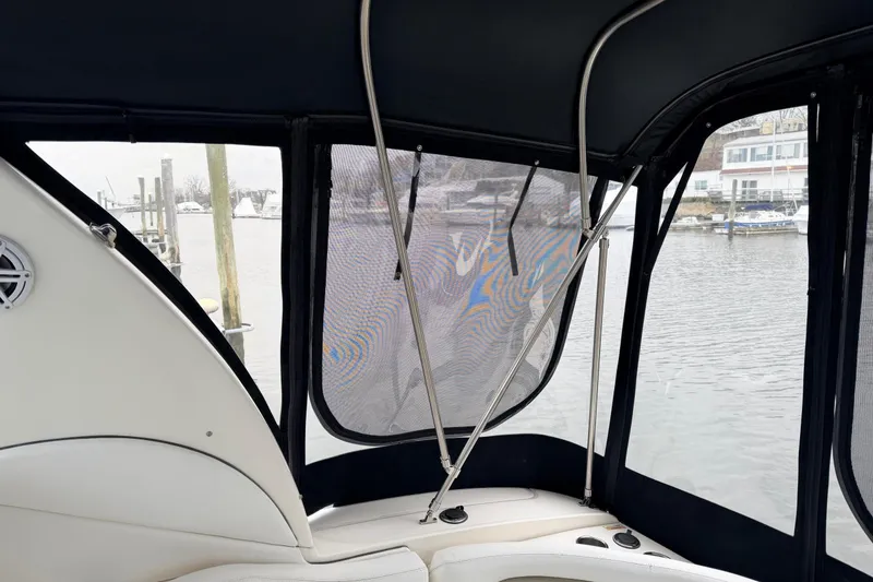 Slide: The Image of 2007 Sea Ray Sundancer 320 interior view with marina backdrop. - 19