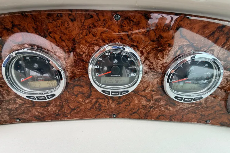 Slide: The Image of Dashboard of 2007 Sea Ray Sundancer 320 with speedometer and RPM gauges. - 22