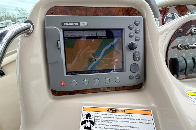 Slide: The Image of Raymarine GPS system on 2007 Sea Ray Sundancer 320 boat dashboard. - 24