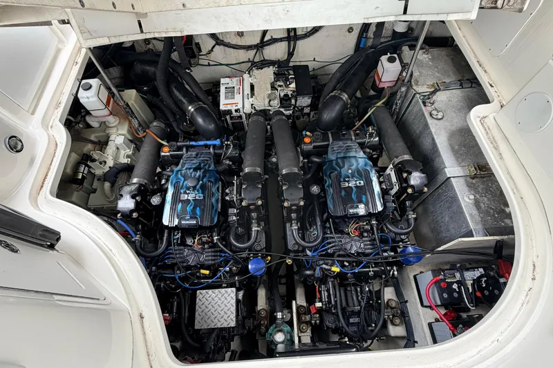 Slide: The Image of Engine compartment of a 2007 Sea Ray Sundancer 320 boat, showcasing dual engines. - 26