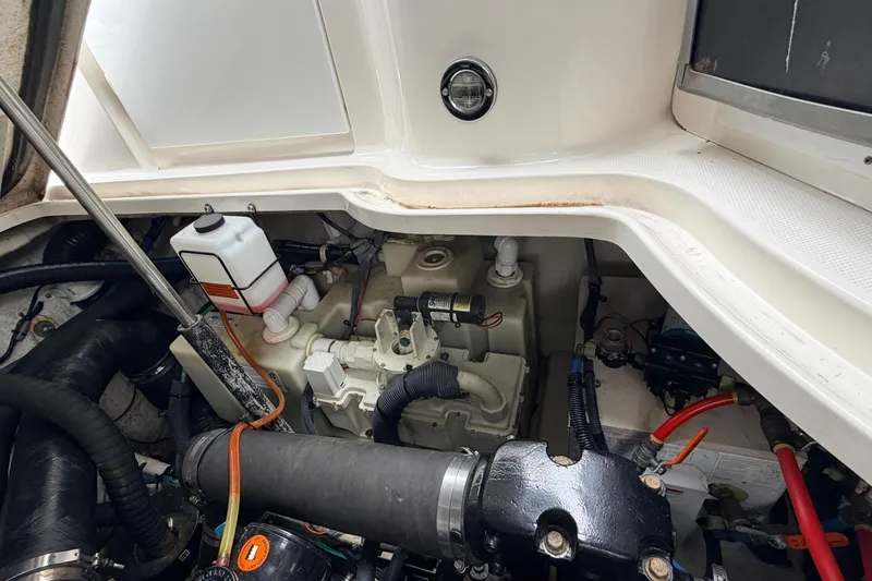 Slide: The Image of Engine compartment of a 2007 Sea Ray Sundancer 320 boat, showing mechanical components. - 27