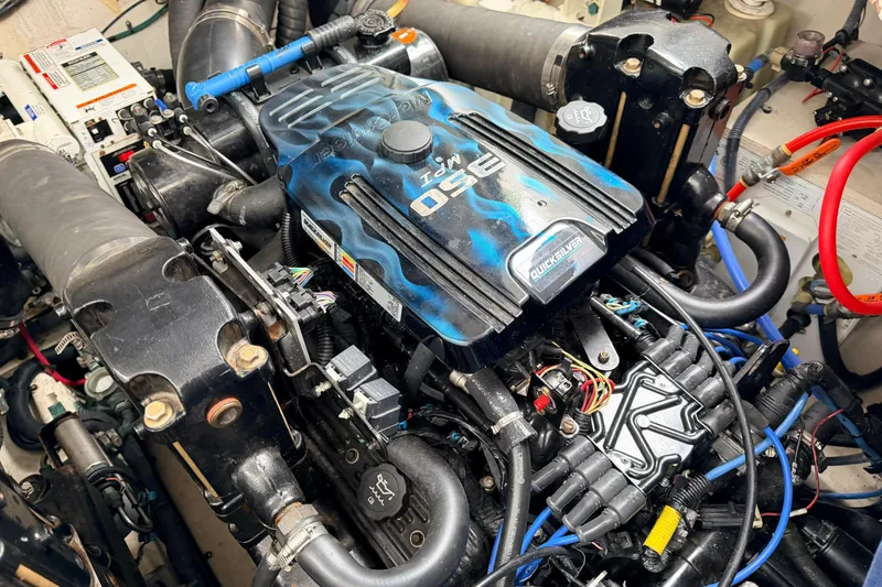Slide: The Image of Engine compartment of a 2007 Sea Ray Sundancer 320, featuring a powerful marine engine. - 30