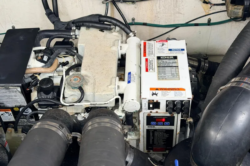 Slide: The Image of Engine compartment of a 2007 Sea Ray Sundancer 320 with Kohler generator and wiring. - 31