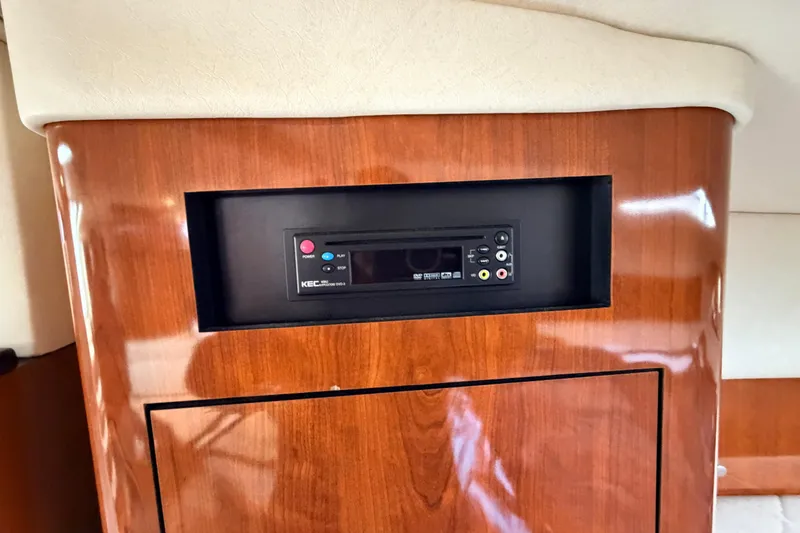 Slide: The Image of Wooden interior panel with built-in audio system on 2007 Sea Ray Sundancer 320 yacht. - 34