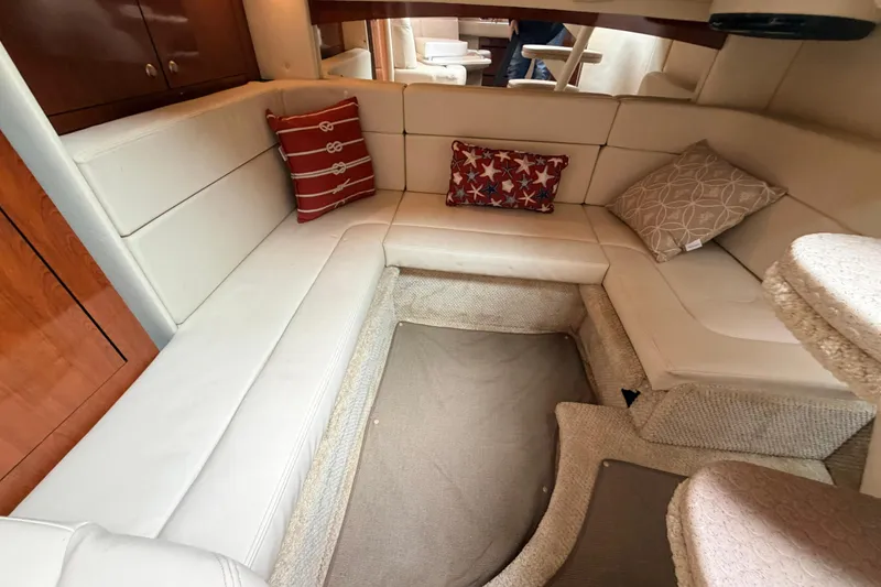 Slide: The Image of Interior of 2007 Sea Ray Sundancer 320 with cozy seating and decorative pillows. - 35