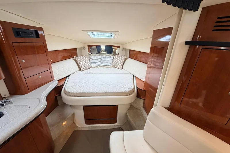 Slide: The Image of Luxurious cabin interior of 2007 Sea Ray Sundancer 320 yacht with cozy bed and wood finish. - 37