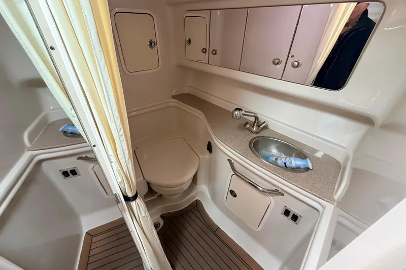 Slide: The Image of 2007 Sea Ray Sundancer 320 bathroom with sink, toilet, and storage cabinets. - 38