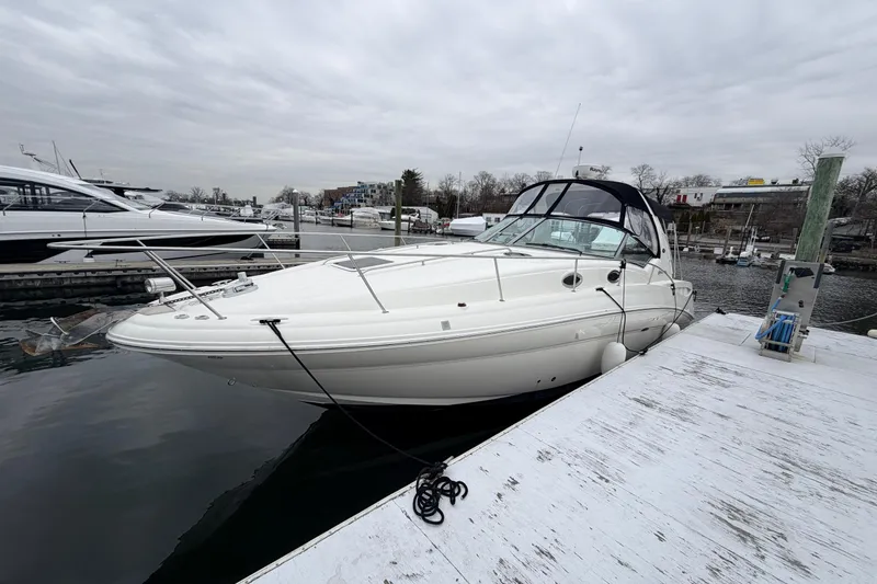 Slide: The Image of 2007 Sea Ray Sundancer 320 docked at marina under cloudy sky. - 4