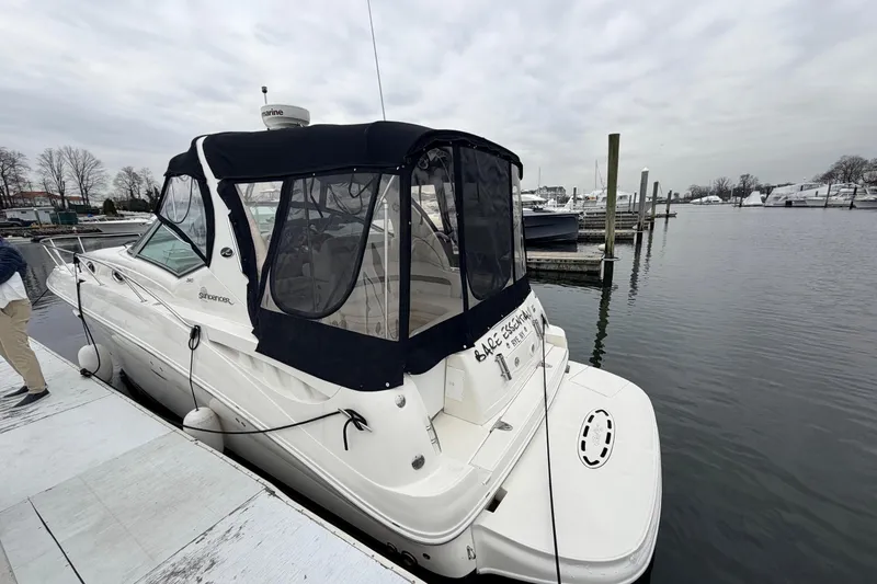 Slide: The Image of 2007 Sea Ray Sundancer 320 docked at a marina on a cloudy day. - 5
