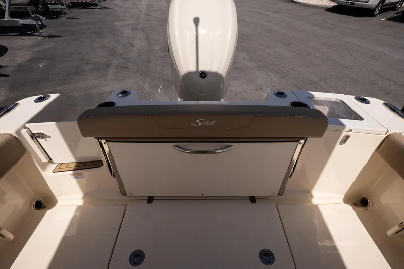 Slide: The Image of 2026 Scout 215 XSF boat interior with seating and storage compartments. - 17