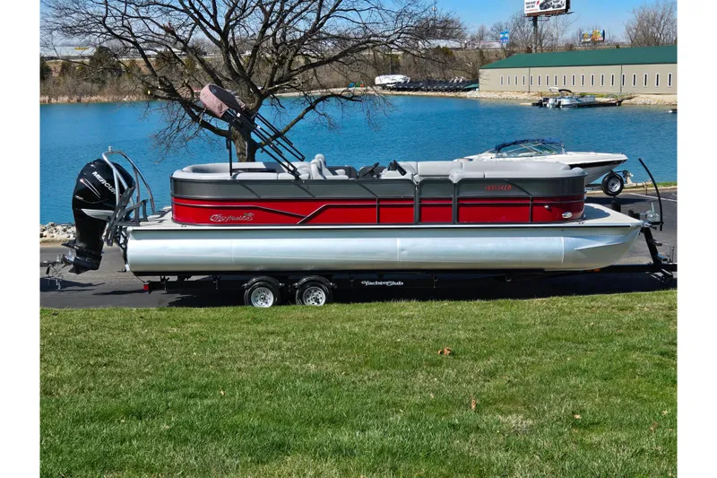 The Image of 2018 Misty Harbor 2585 Biscayne Bay CU pontoon boat on trailer by a lake. - 0