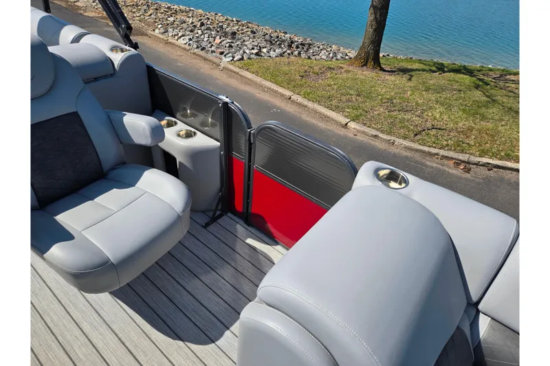 Slide: The Image of 2018 Misty Harbor 2585 Biscayne Bay CU pontoon boat interior with gray seating and cup holders. - 16
