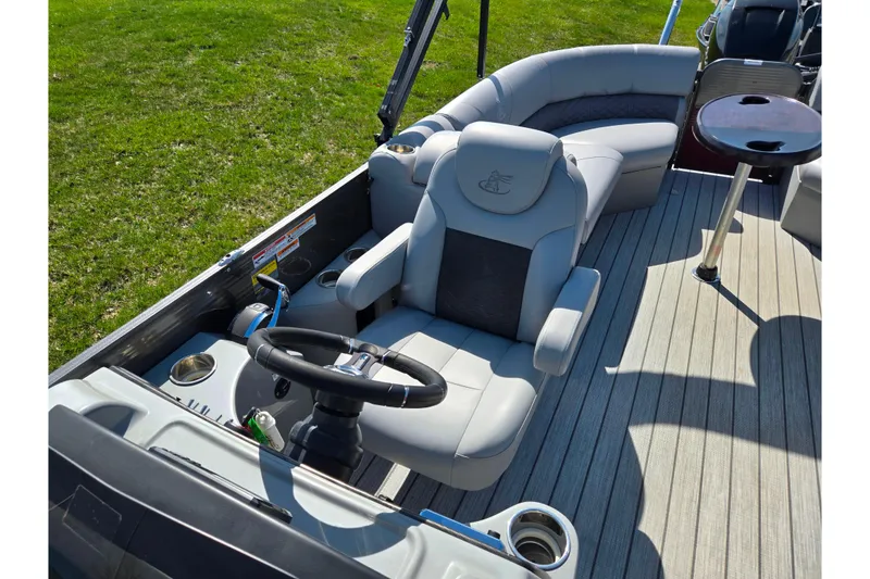 Slide: The Image of 2018 Misty Harbor 2585 Biscayne Bay CU boat interior with captain's chair and seating. - 17
