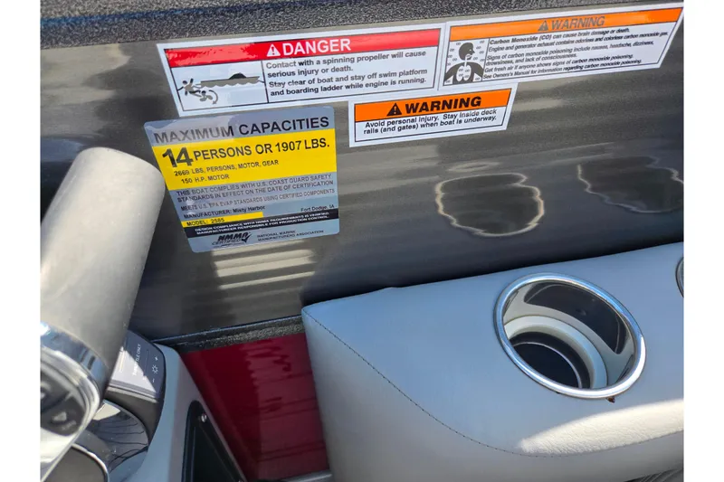 Slide: The Image of 2018 Misty Harbor 2585 Biscayne Bay CU boat capacity and safety warning labels. - 18