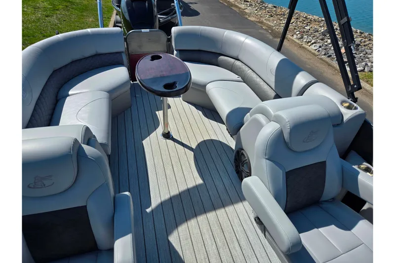 Slide: The Image of 2018 Misty Harbor 2585 Biscayne Bay CU pontoon boat with luxurious seating and table. - 19
