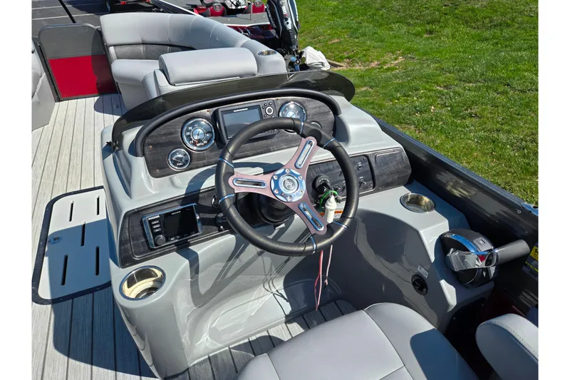 Slide: The Image of 2018 Misty Harbor 2585 Biscayne Bay CU boat dashboard with steering wheel and controls. - 23