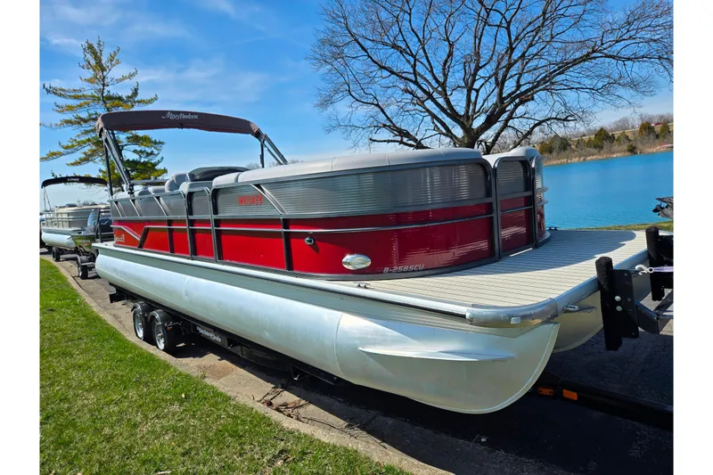 Slide: The Image of 2018 Misty Harbor 2585 Biscayne Bay CU pontoon boat by a lake. - 8
