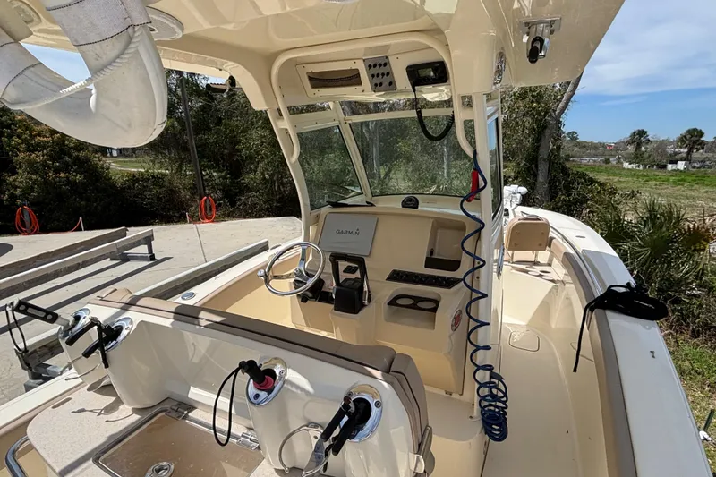 Slide: The Image of 2016 Scout 255 LXF boat interior with steering wheel and navigation equipment. - 1