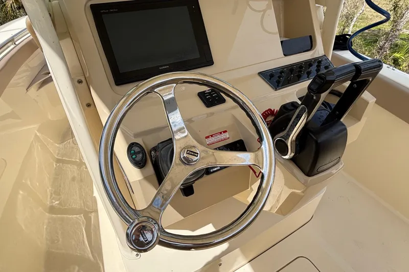 Slide: The Image of Steering console of a 2016 Scout 255 LXF boat with Garmin display and controls. - 11