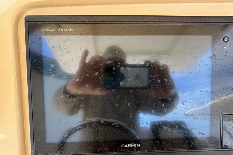 Slide: The Image of Reflection on Garmin GPS screen in 2016 Scout 255 LXF boat cockpit. - 12