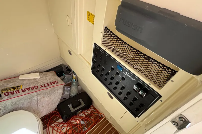 Slide: The Image of Interior of 2016 Scout 255 LXF boat with control panel and safety gear. - 17