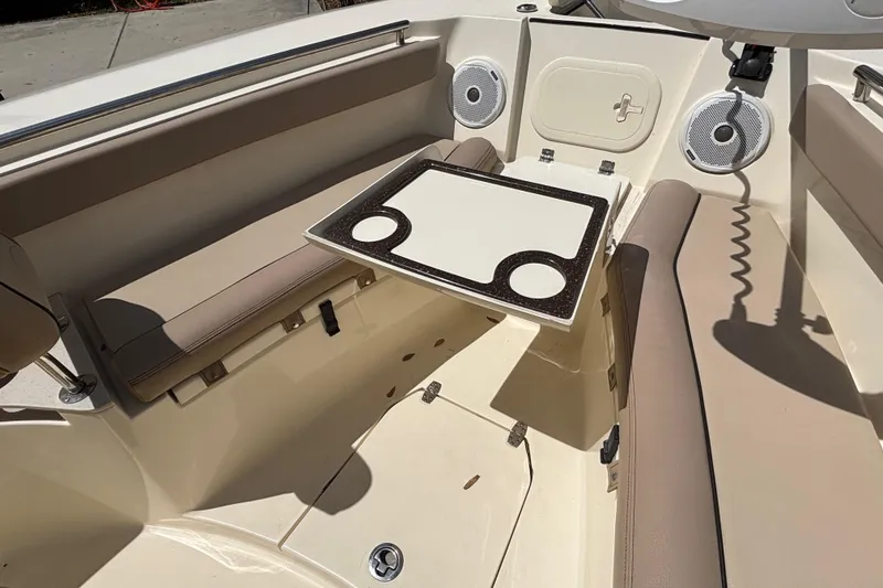 Slide: The Image of Interior of a 2016 Scout 255 LXF boat with seating and table. - 24