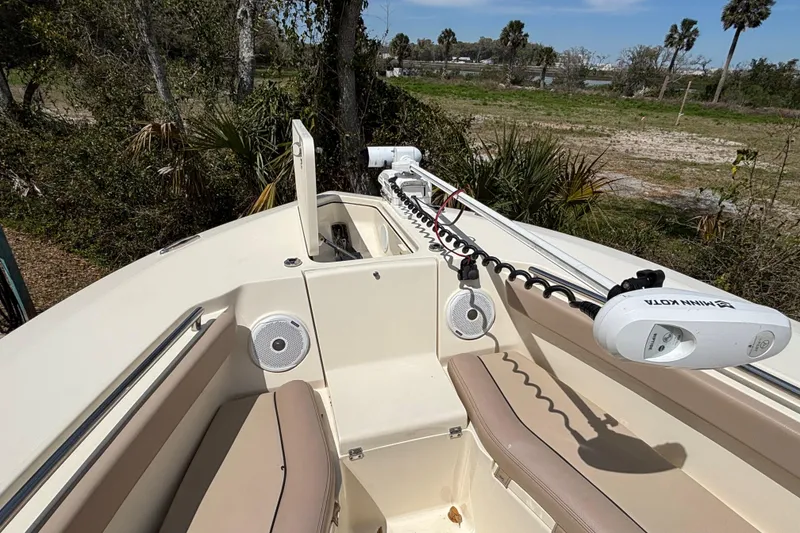 Slide: The Image of 2016 Scout 255 LXF boat interior with Minn Kota trolling motor and speakers. - 27